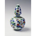 A Chinese Doucai porcelain gourd vase, Qianlong seal mark, decorated externally with blossoming