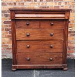 A Victorian mahogany chest of drawers, with a cushion frieze drawer, above an arrangement of two