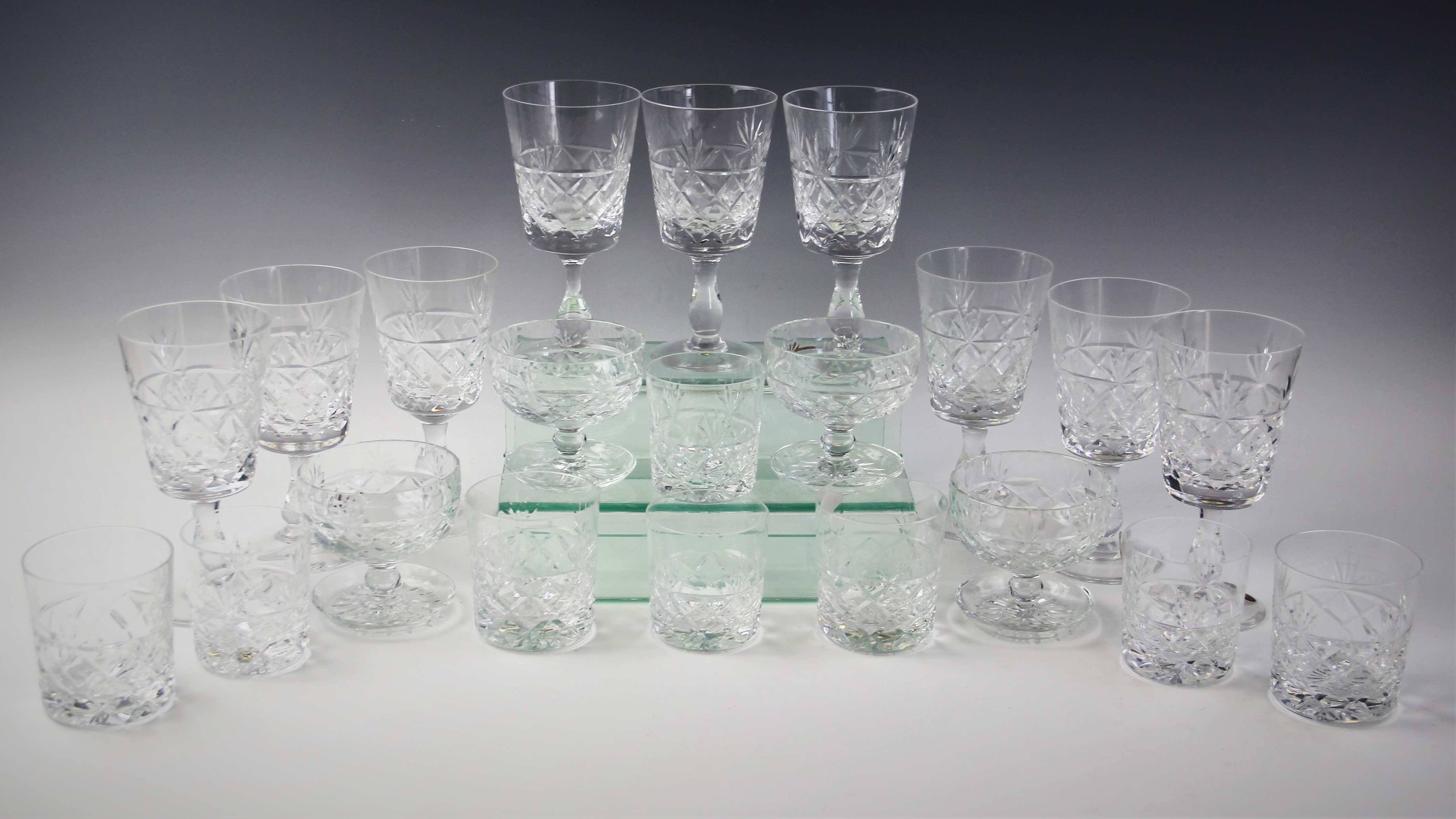 A suite of Royal Brierley Crystal glasses in the Bruce pattern, comprising: sixteen wine glasses,