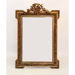 A 19th century style giltwood and composite wall mirror, 20th century, with a foliate open work