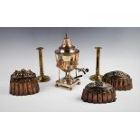 Two Victorian copper jelly moulds, each of stepped turret form, one surmounted by a pineapple motif,