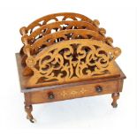 A Victorian figured walnut Canterbury, the four fretwork dividers creating three divisions, above