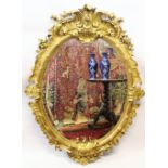 A 19th century Rococo style gilt wood and gesso oval wall mirror, the foliate swept frame with a