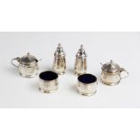 A silver condiment set by Walker & Hall, Birmingham 1955, comprising two pepperettes, two open salts