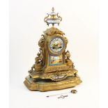 A 19th century French gilt metal and bleu celeste porcelain panel clock, the architectural case