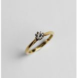 A diamond solitaire ring, the central round brilliant cut diamond weighing an estimated 0.20 carats,