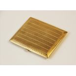 An Art Deco 9ct gold cigarette case, of rectangular form with engine turned decoration to exterior