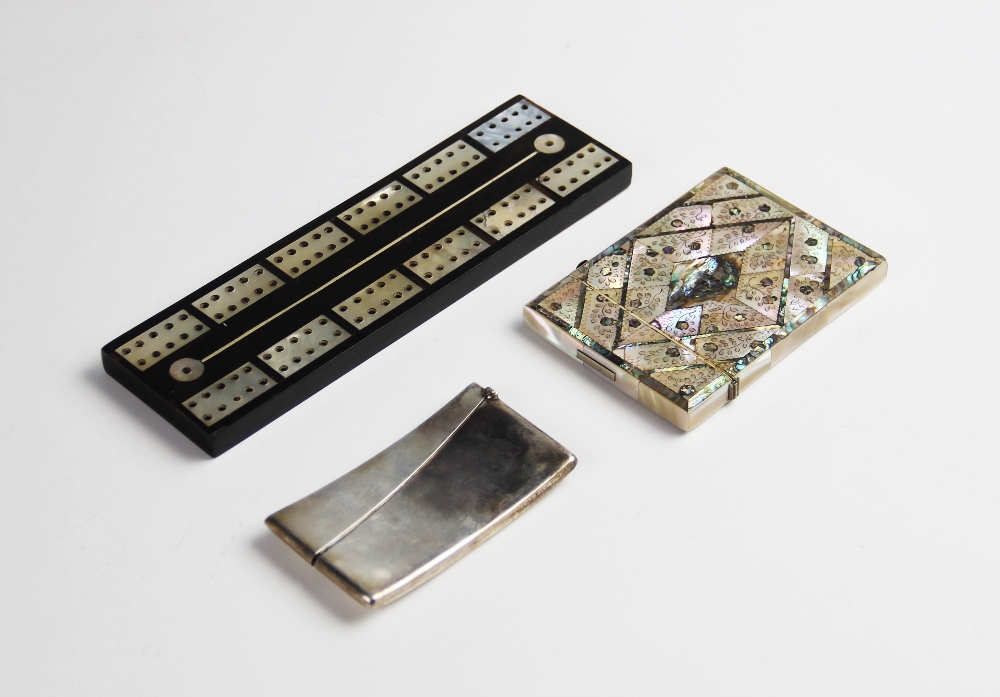 A mother of pearl card case, of rectangular form inlaid with abalone shell and engraved floral