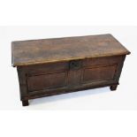 A late 17th/early 18th century oak coffer, the two plank rectangular moulded cover above two