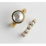 A pearl and diamond ring, comprising a round mabe pearl measuring 9mm diameter, with a small round