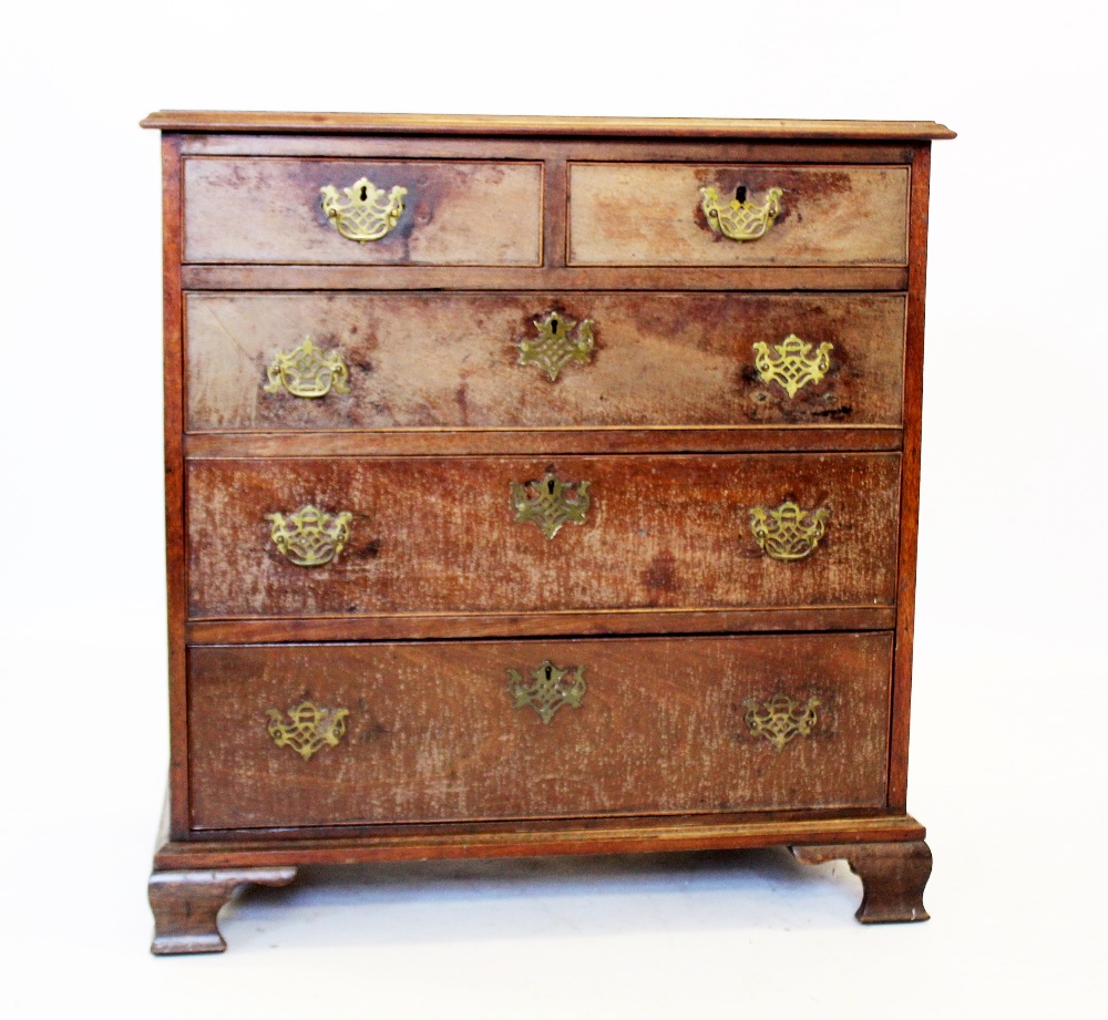 A George III mahogany chest of drawers, the rectangular moulded top above two short and three long