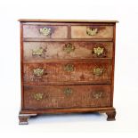 A George III mahogany chest of drawers, the rectangular moulded top above two short and three long