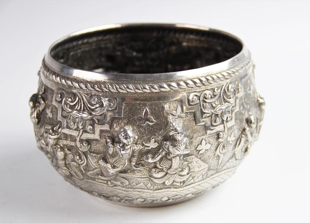 A late 19th/early 20th century Burmese white metal bowl, of circular form decorated in high relief - Image 2 of 6