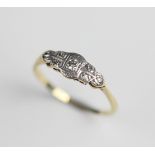 An early 20th century diamond set ring, comprising a central round brilliant cut diamond weighing