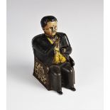 An American cast iron novelty mechanical 'Tammany Bank' money box, cast as William Magear Tweed (