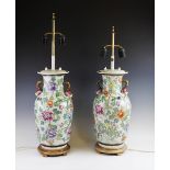 A pair of Chinese porcelain baluster vase table lamps, 20th century, each applied with polychrome