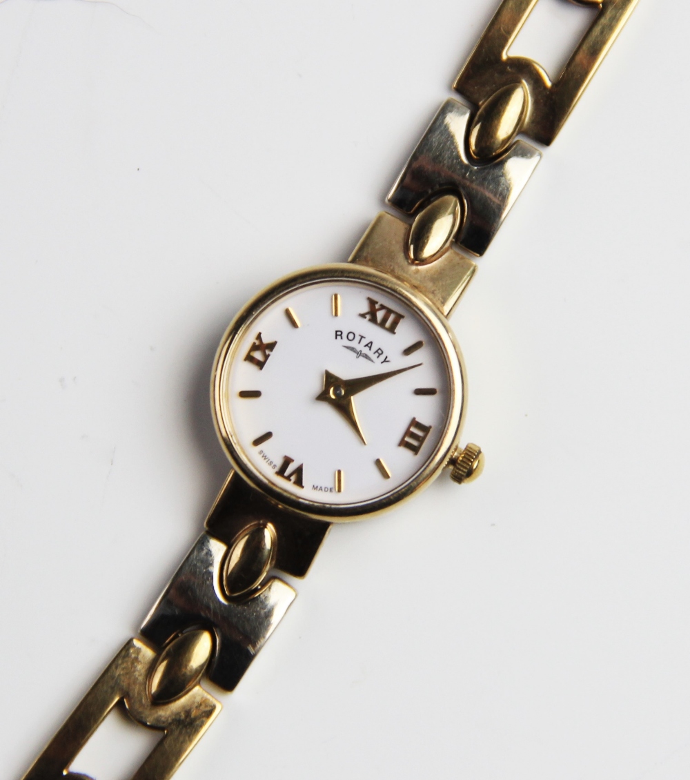 A lady's 9ct gold Rotary wristwatch, the round white dial with Roman numerals and baton markers, set