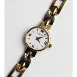 A lady's 9ct gold Rotary wristwatch, the round white dial with Roman numerals and baton markers, set