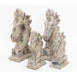 Two pairs of composite stone horse busts, each modelled with a flowing mane and mounted upon a