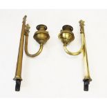 A pair of Victorian brass ecclesiastical wall mounted oil lamps, the tapering hexagonal supports