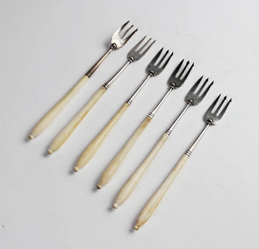 Six silver ivory handled pickle forks, four by Chawner & Co, London 1857, two by Elkington & Co,