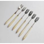 Six silver ivory handled pickle forks, four by Chawner & Co, London 1857, two by Elkington & Co,