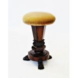 A William IV rosewood piano stool, the revolving circular padded seat raised upon a hexagonal column