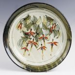 Colin Kellam (British contemporary), a stoneware charger, decorated with sprigs of fuschia,