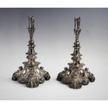 A pair of silver plated candlesticks in the baroque revival style, mid 19th century, each with