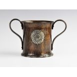 A Hugh Wallis Arts & Crafts copper loving cup, early 20th century, the hand beaten cup of flared