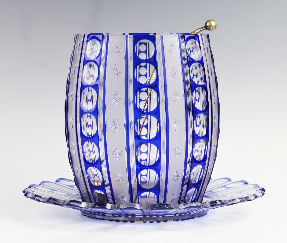 An early 20th century blue flashed cut glass punch bowl and stand with associated EPNS ladle, 24cm