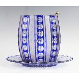 An early 20th century blue flashed cut glass punch bowl and stand with associated EPNS ladle, 24cm