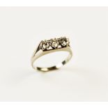 A diamond three-stone ring, each round brilliant cut diamond weighing approximately 0.25 carats,