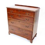 An Edwardian mahogany chest of drawers, the rectangular moulded top above four graduated long