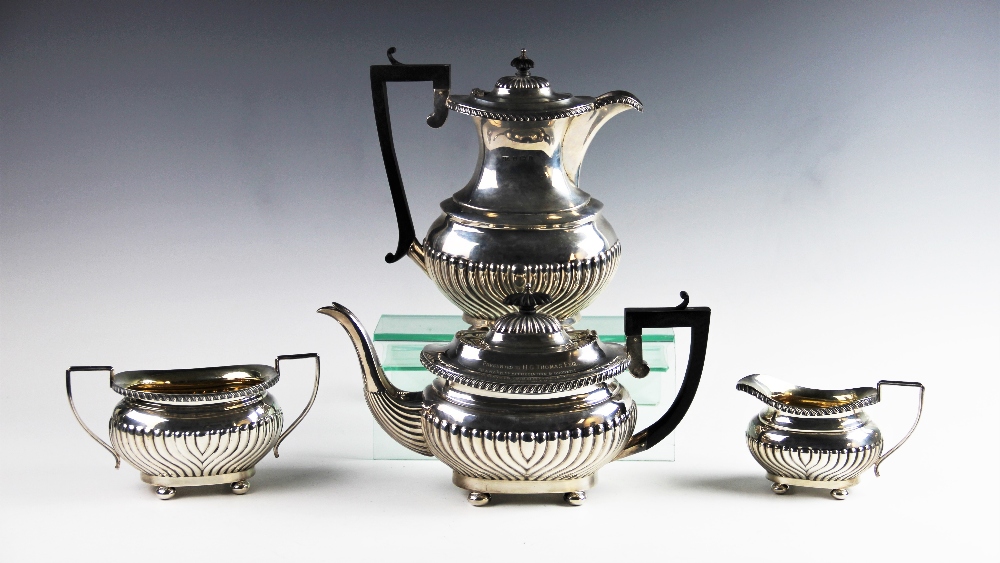 An Edwardian four piece silver tea service by Joseph Gloster Ltd, Birmingham 1907/08, comprising