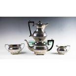 An Edwardian four piece silver tea service by Joseph Gloster Ltd, Birmingham 1907/08, comprising