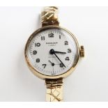 A lady's vintage 9ct gold Excalibur 17 jewels Incabloc wristwatch, the round silver toned dial