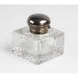 A late Victorian silver mounted cut glass inkwell by George Bedingham, London 1899, of compressed