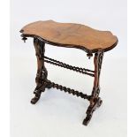 A Victorian burr walnut occasional table, the serpentine quarter veneered top upon a pair of open