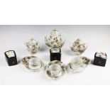 A Noritake porcelain tea service, comprising; a teapot and cover, three tea cups (one at fault),