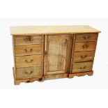 A Victorian pine kitchen dresser base, the rectangular top with a later galleried back, above