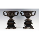 A pair bronze Warwick vases, after the antique, each elaborately decorated and of typical form