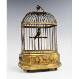 A late 19th century/early 20th century French singing bird automaton, the single bird upon a t-bar