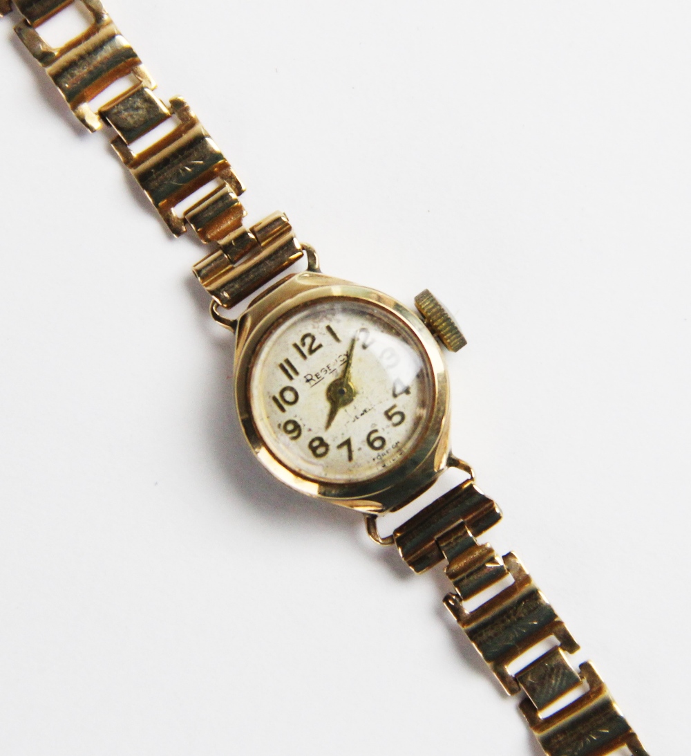 A vintage lady's 9ct Regency wristwatch, the round cream with with Arabic numerals, set to a round