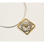 A Tiffany 18ct gold and silver daisy pendant, designed as a two-colour moulded daisy set to a square