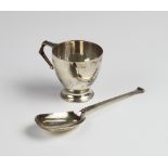 A George V silver christening mug by Wakely & Wheeler, London 1917, of tapered form on spreading