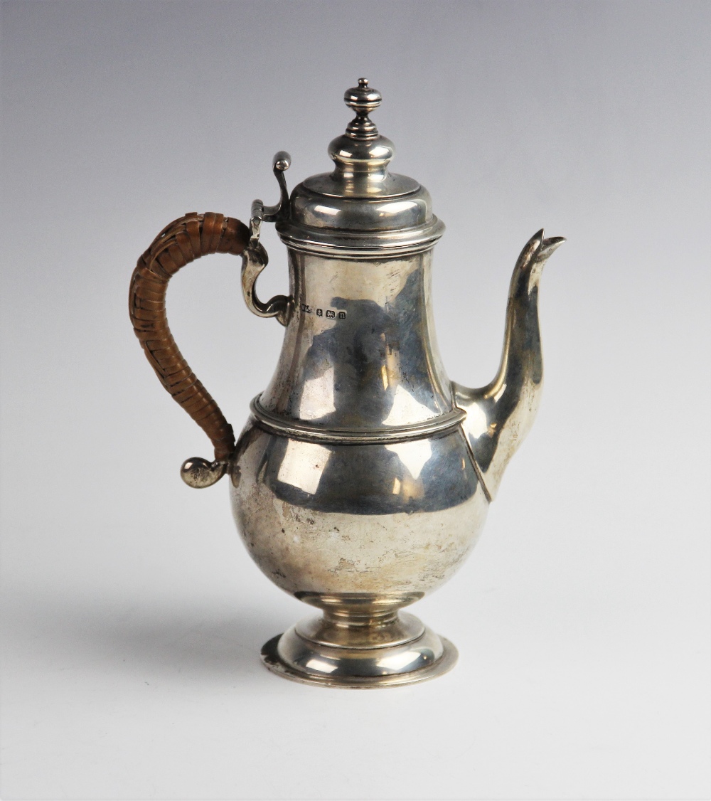 A George V silver coffee pot by Wilson & Sharp, Birmingham 1912, of baluster form on domed