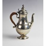 A George V silver coffee pot by Wilson & Sharp, Birmingham 1912, of baluster form on domed
