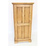 A Victorian pine and later constructed cupboard, the single panelled door enclosing five fixed