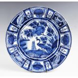 An 18th century Delft - Kraak style blue and white charger, tin glazed and of circular form,